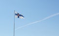 State flag of Finland flies from a flagpole Royalty Free Stock Photo