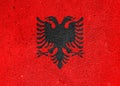 State flag of the Republic of Albania on a plastered wall