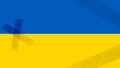 The state flag of Ukraine in patches. Patches on the flag from the war. Pain in the heart of Ukrainians. Blue and yellow flag