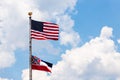 State of Mississippi flag and United States flag waving in the wind Royalty Free Stock Photo