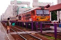 State Railways of Thailand SRT orange diesel electric train locomotive parked at Donmuang railway station