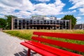 State theater in Kassel with red bench in foreground, Germany