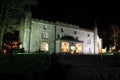 Stately home lit at night