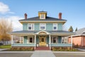 stately italianate with eaves and a slate roof