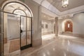 Stately portal of a house with doors with semicircular arches, light marble floors, beveled glass and lots of space