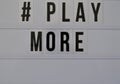 Hashtag play more statement on white background