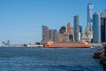 Staten Island Ferry crosses in front of New York City skyline Royalty Free Stock Photo