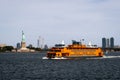 The Staten Island ferry sailing past The Statue of Liberty Royalty Free Stock Photo