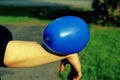 Static electricity shown by balloon attached to female arm