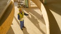 Static engineer looks at his floor plans and observes the prefabricated house. Royalty Free Stock Photo