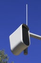 Static speed or safety camera against a blue sky