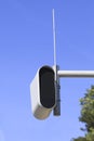 Static speed or safety camera against a blue sky