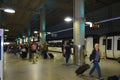 Station London Stansted with arriving passengers and the Stansted Express in background