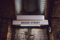 Station name sign on the platform of Baker Street station, London, UK