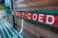 Station name on wooden bench at the railway station platform in Betws-y-Coed, a popular tourist town for outdoor pursuits Royalty Free Stock Photo