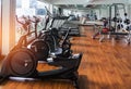 Stationary bikes and health exercise equipment in modern fitness center room