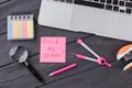 Stationary clerical items on the dark wooden table.