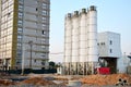 Stationary concrete batching plant on construction site. Royalty Free Stock Photo