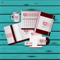 Stationary templates of heart design of business stationery over aquamarine wooden background