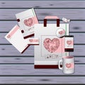 Stationary templates of heart design of business stationery over violet wooden background