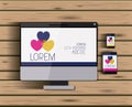 Stationary templates with tech devices hearts corporate image in screen on wooden background