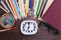 Stationery around white clock Royalty Free Stock Photo