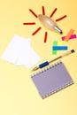 Stationery and blocknote. Light bulb with red rays Royalty Free Stock Photo