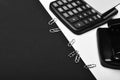 Stationery and calculator, close up. Business and work concept: office tools opposite black space Royalty Free Stock Photo