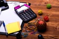 Stationery, calculator and xmas balls. Clip folder with white paper