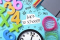 Stationery, clock and text back to school Royalty Free Stock Photo