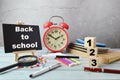 Stationery items and chalkboard written with BACK TO SCHOOL