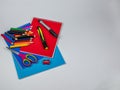 Stationery on light background, set of colored pencils for drawing, two markers, pencil sharpener, scissors