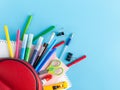 Stationery next to the bag backpack, school supplies for students children and students, soon to school, back to school, school an Royalty Free Stock Photo