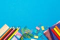 Stationery. School and office supplies on a blue background.Advertising space