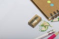 Stationery for school and teaching. Notepad and pencils for writing and drawing. Pencil sharpener with pencil shaving. Royalty Free Stock Photo