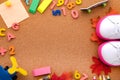 stationery, slips, letters, toys and an open notebook on a cork background.Top view. Space for text Royalty Free Stock Photo