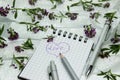 Stationery on small purple flowers and silver ribbon