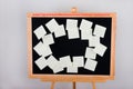 Stationery stickers close-up and copy space. Ukrainian alphabet on a chalkboard. Notes for remind. Sticky notes on a black board i Royalty Free Stock Photo
