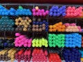 Colorful pen being arranged in a shelf for sale. Royalty Free Stock Photo