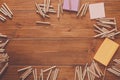 Sticky notes and color pencils on wooden desk Royalty Free Stock Photo