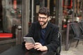 Statistician working with diagram and tablet at cafe table . Royalty Free Stock Photo