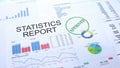 Statistics report approved, hand stamping seal on official document, statistics