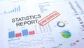 Statistics report confidential, stamping seal on official document, statistics