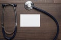 Statoscope and blank notebook on wooden table Royalty Free Stock Photo