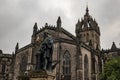 Statue of Adam Smith at Royal Mile street with St Giles Cathedral in the background Royalty Free Stock Photo