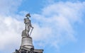 Statue of Admiral Nelson in London with a surgical mask