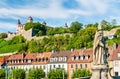 Statue on the Alte Mainbrucke and Marienberg Fortress in Wurzburg, Germany Royalty Free Stock Photo