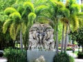 Statue amid palm trees outside University of Tampa