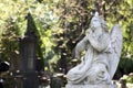 Statue of ancient angel on cemetery Royalty Free Stock Photo