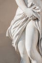Statue of ancient sensual half naked Renaissance Era woman with long baked legs in Potsdam at smooth wall background, Germany Royalty Free Stock Photo